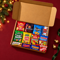 Secret Santa Snack Gift Box with 12 sealed packs on a festive burgundy tabletop