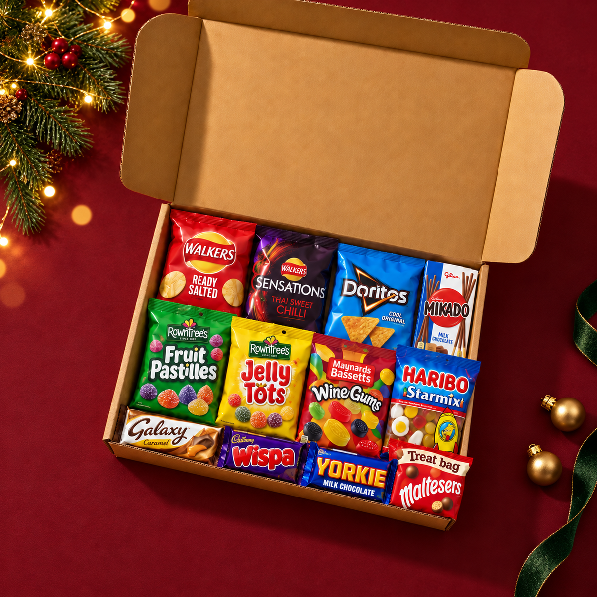 Secret Santa Snack Gift Box with 12 sealed packs on a festive burgundy tabletop