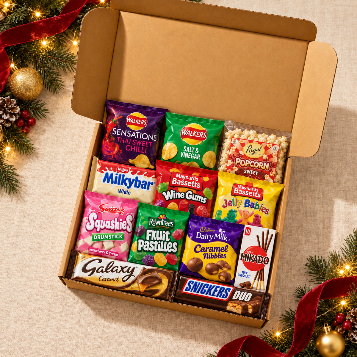 Christmas Hug from Afar Snack Gift Box with 12 sealed packs on a warm cream festive tabletop