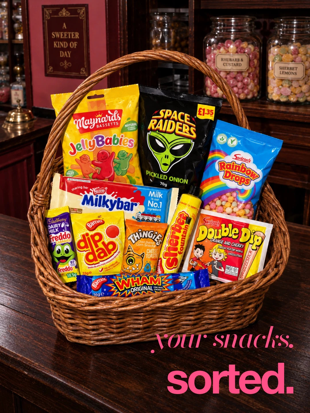 Your snacks, sorted: a wicker basket of classic sweets and snacks in a retro sweet shop. Illustrative selection; contents vary.